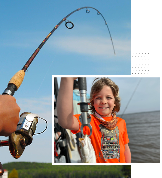 kid smiling with a fish